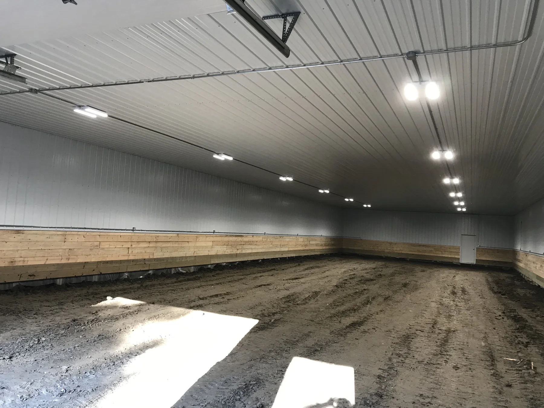 High-bay lighting installed inside a large shop