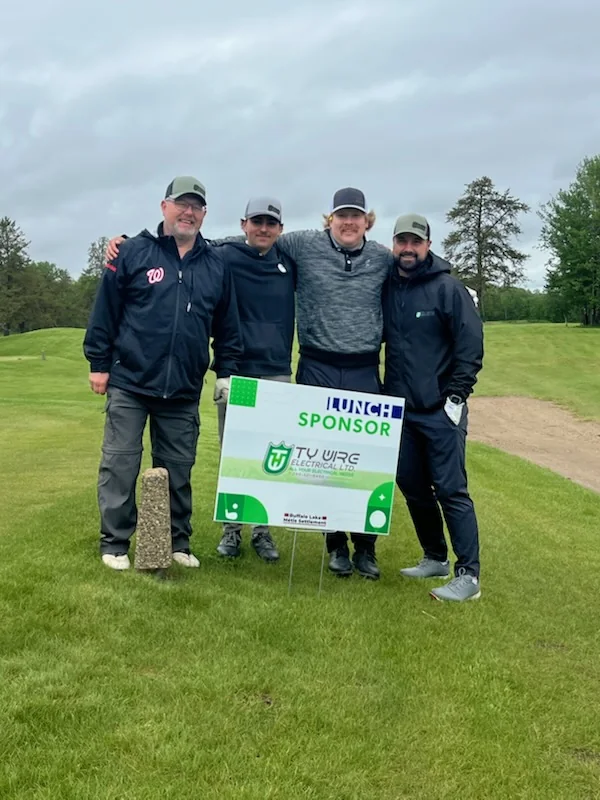 Ty-Wire team members at a community golf event